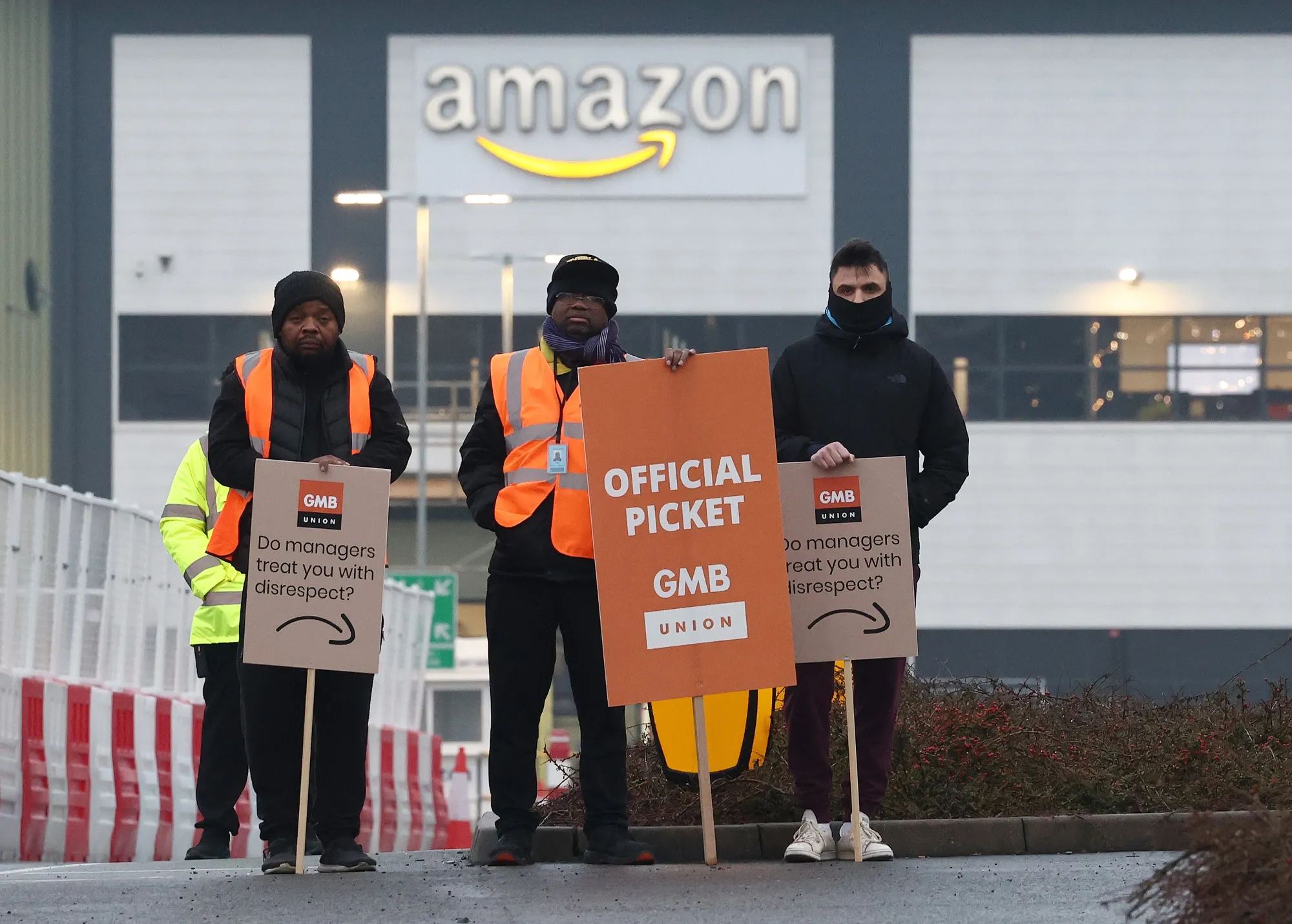 Amazon workers hold placards on a picket line during a strike over pay at the Amazon.com Inc. fulfilment centre in Coventry, UK, on&nbsp;Feb. 28.