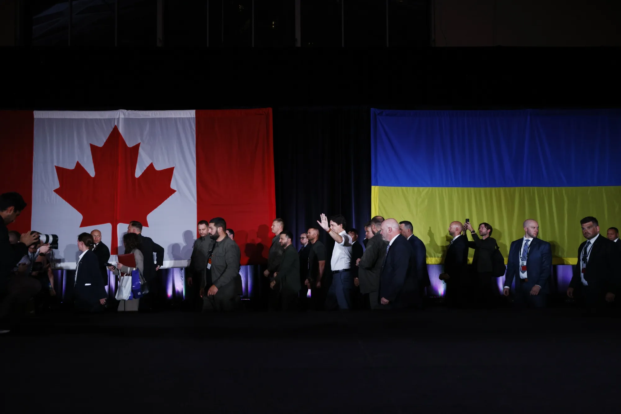 Volodymyr Zelenskiy, Ukraine's president, center left, and Justin Trudeau, Canada's prime minister, center right, wave as they leave an event in Toronto last September.&nbsp;