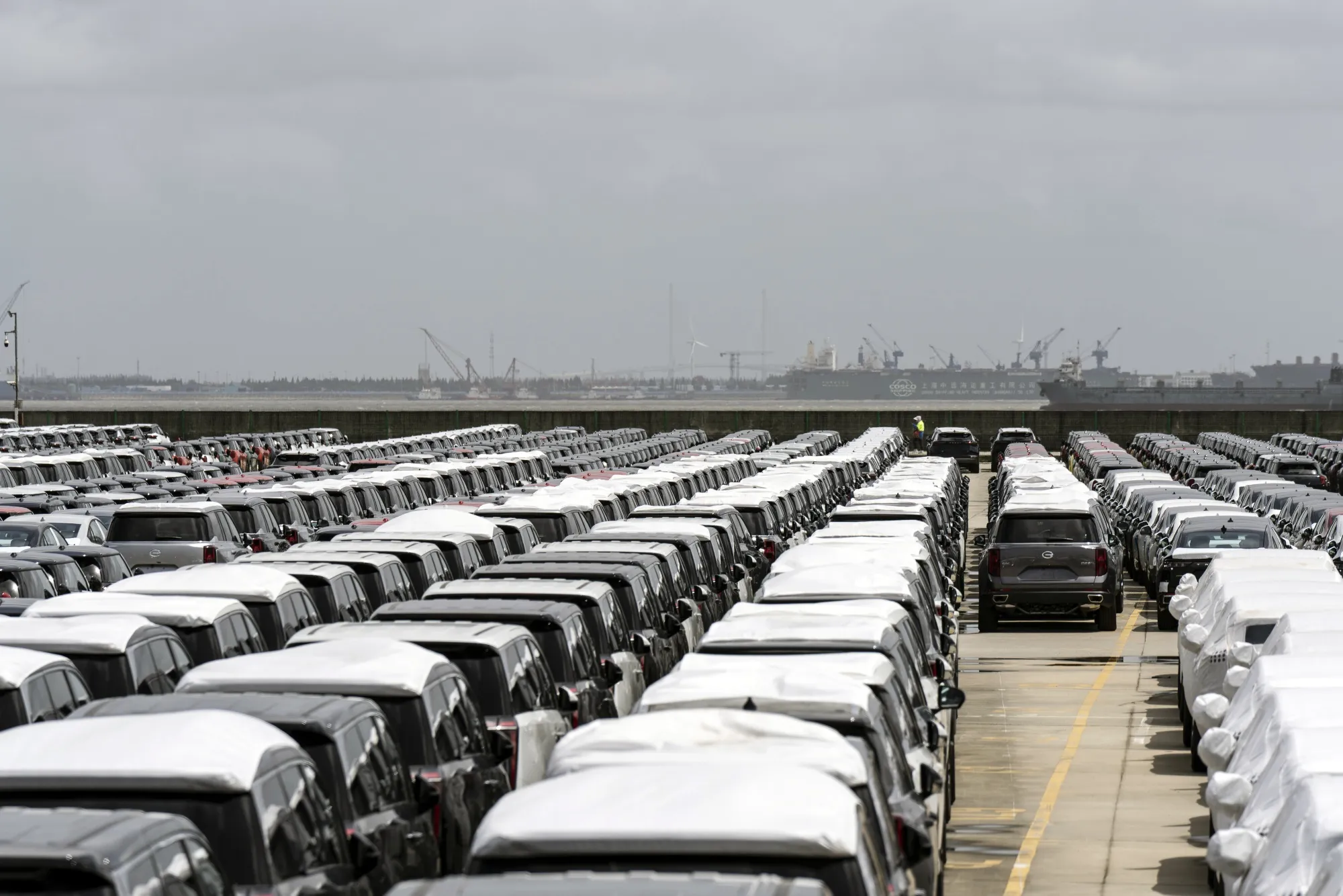 Vehicles waiting for shipment at a lot of a shipping terminal in Shanghai.