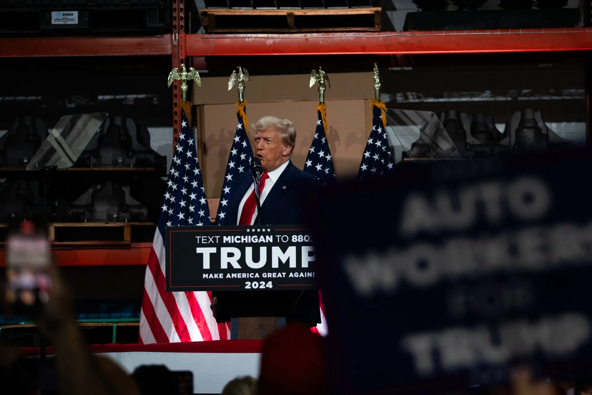 Former President Donald Trump speaks during a campaign event at Drake Enterprises in Clinton Township, Michigan, on Sept. 27.