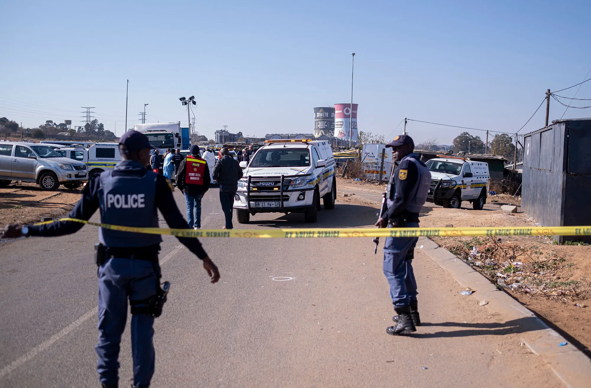 South African police officers&nbsp;in Soweto on July 10&nbsp;after&nbsp;14 people where shot dead in a tavern.