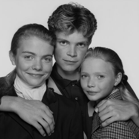 Childhood portraits of Jodie, Jack, and Jemma Kidd decorate the home, like this one circa 1989.