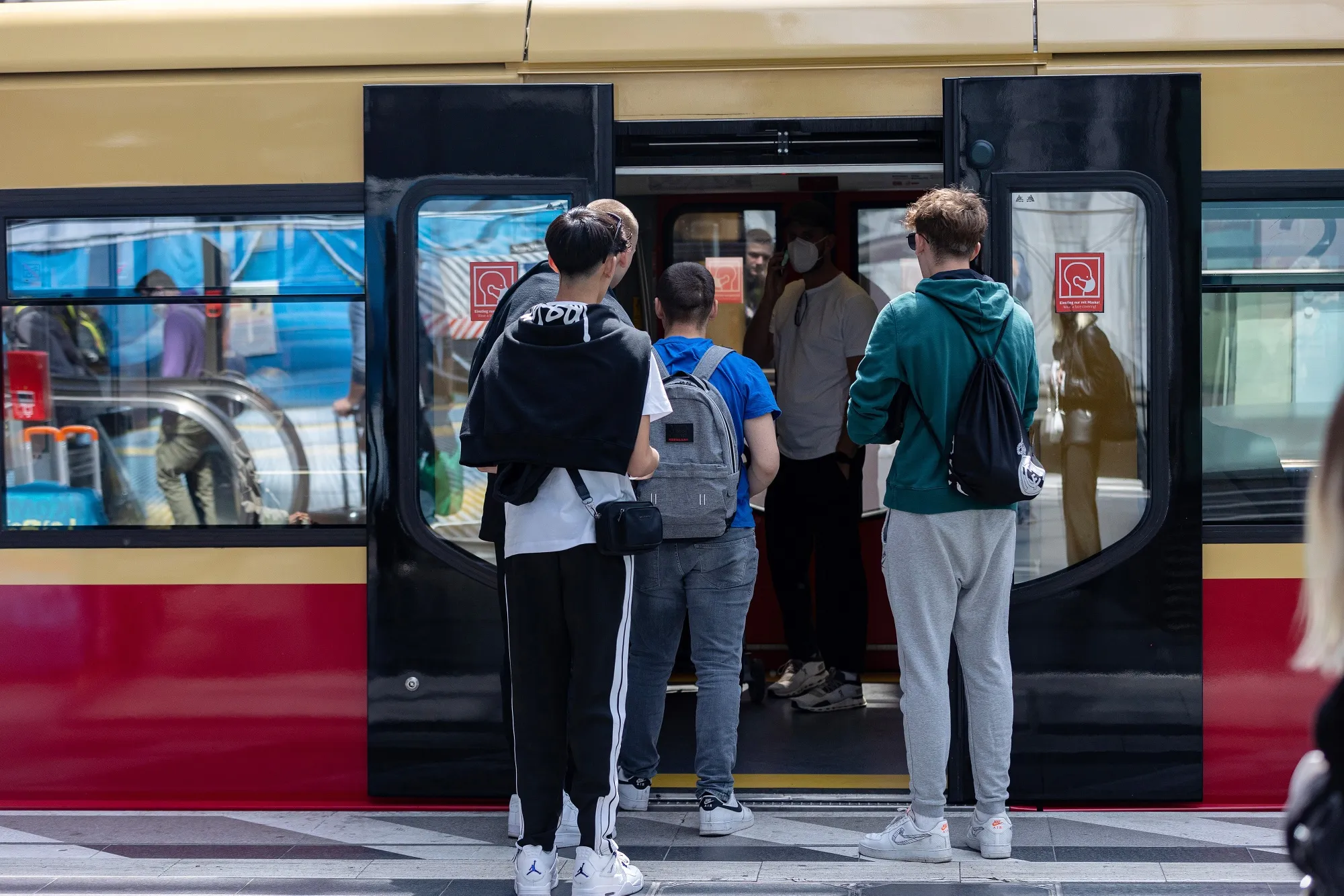 Passengers board a train at Berlin Central Station in Berlin.