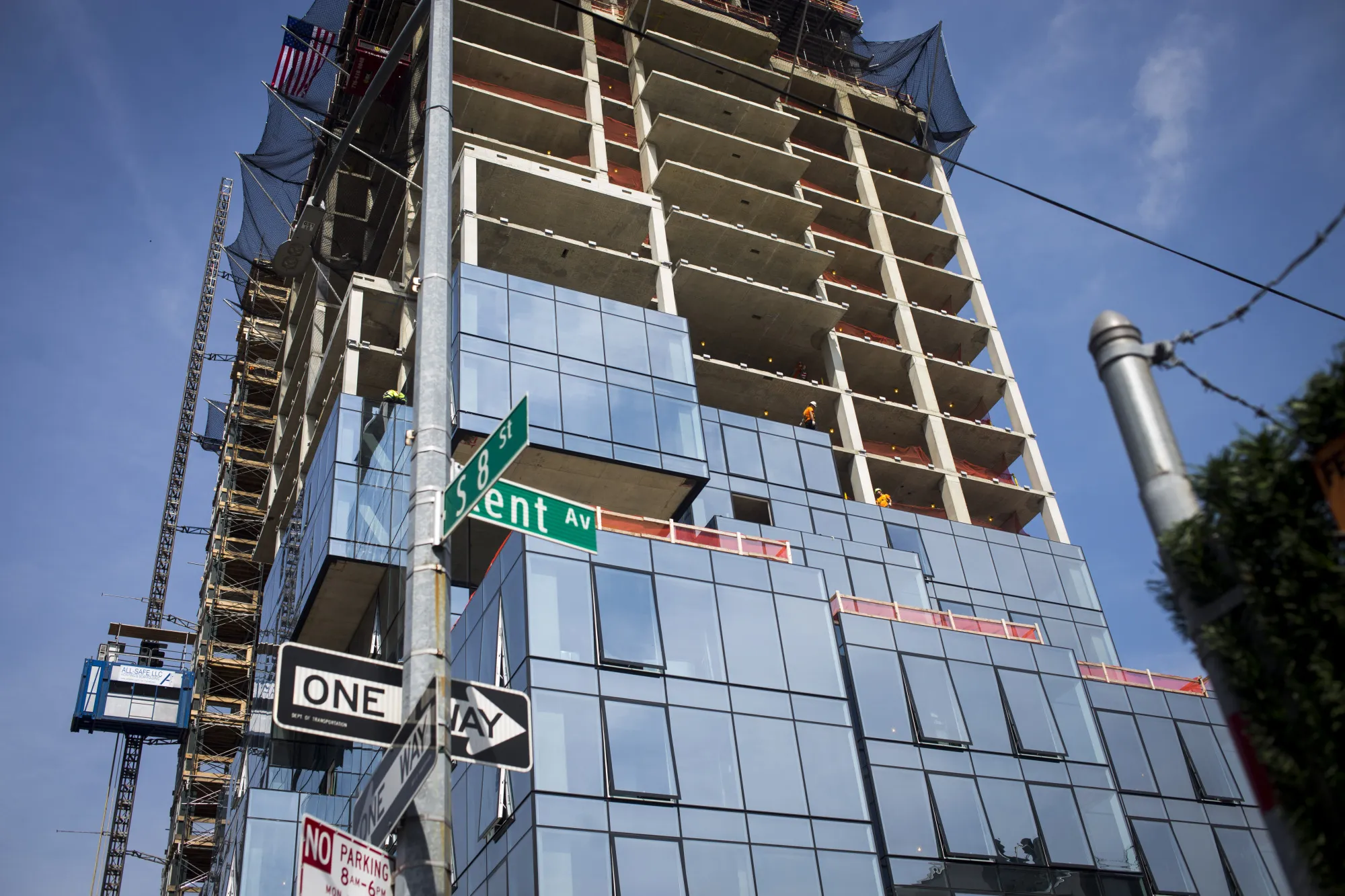 The 416 Kent Avenue apartment development stands under construction in the Williamsburg neighborhood of the Brooklyn borough of New York, U.S., on Friday, July 28, 2017. Former New York Governor Eliot Spitzer now head of his family's real estate company, is building his first apartments at a time when other developers are also filling Brooklyn with rentals. He's delivering 857 units across two towers in New York's hippest and most populous borough, where the apartment supply has been expanding for two years and rents have declined in nine of the past 12 months.