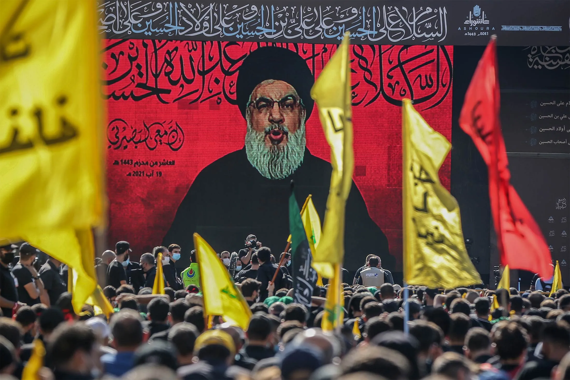 Hezbollah leader Hasan Nasrallah&nbsp;is shown on a screen&nbsp;during a rally in Beirut on Aug. 19.