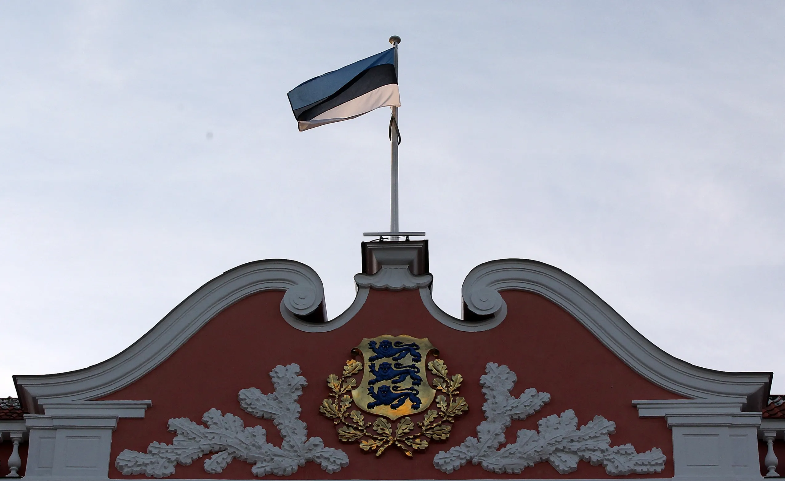 The Estonia&nbsp;flag above&nbsp;the parliament building in Tallinn, Estonia.