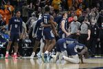 Saint Peter's players celebrate after defeating Murray State in a college basketball game in the second round of the NCAA tournament, Saturday, March 19, 2022, in Indianapolis. (AP Photo/Darron Cummings)