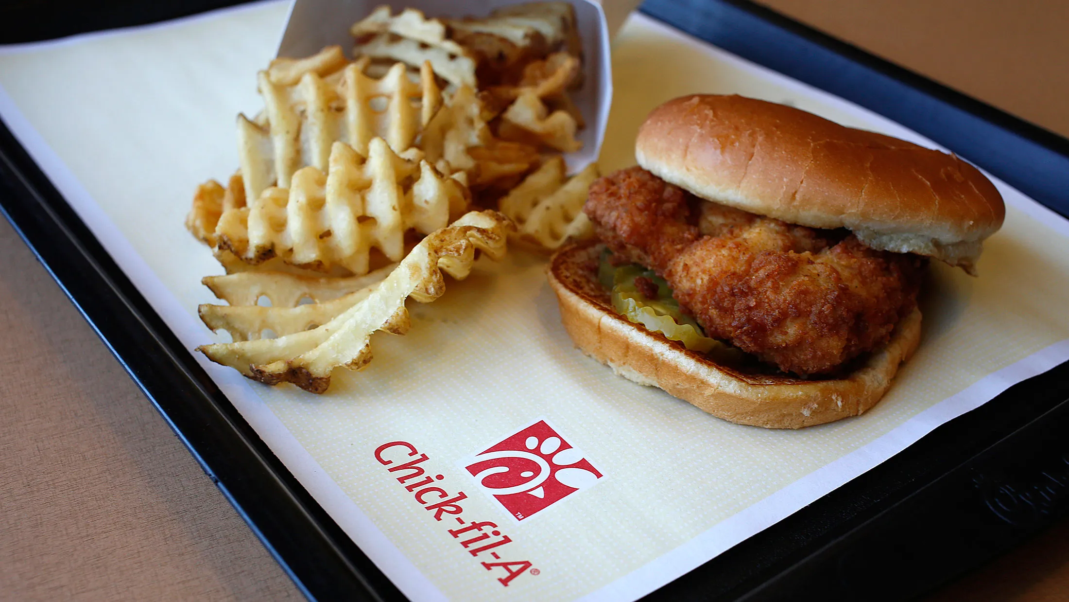 An original chicken sandwich and waffle fries in Bowling Green, Kentucky.

