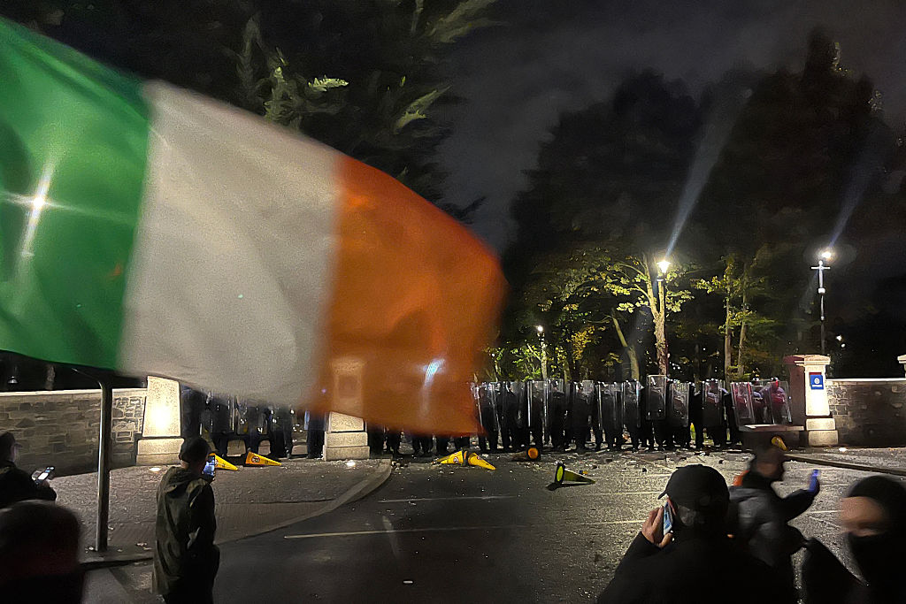 Protesters face a line of police at a demonstration outside a hotel housing asylum seekers in Saggart, south-west of Dublin in Ireland on October 21, 2025. Police in riot gear clashed with at least 500 protesters in Dublin on Tuesday outside an asylum seeker hotel, following allegations that a 10-year-old girl was sexually assaulted. (Photo by Peter MURPHY &#x2F; AFP) (Photo by PETER MURPHY&#x2F;AFP via Getty Images) Photographer: PETER MURPHY&#x2F;AFP