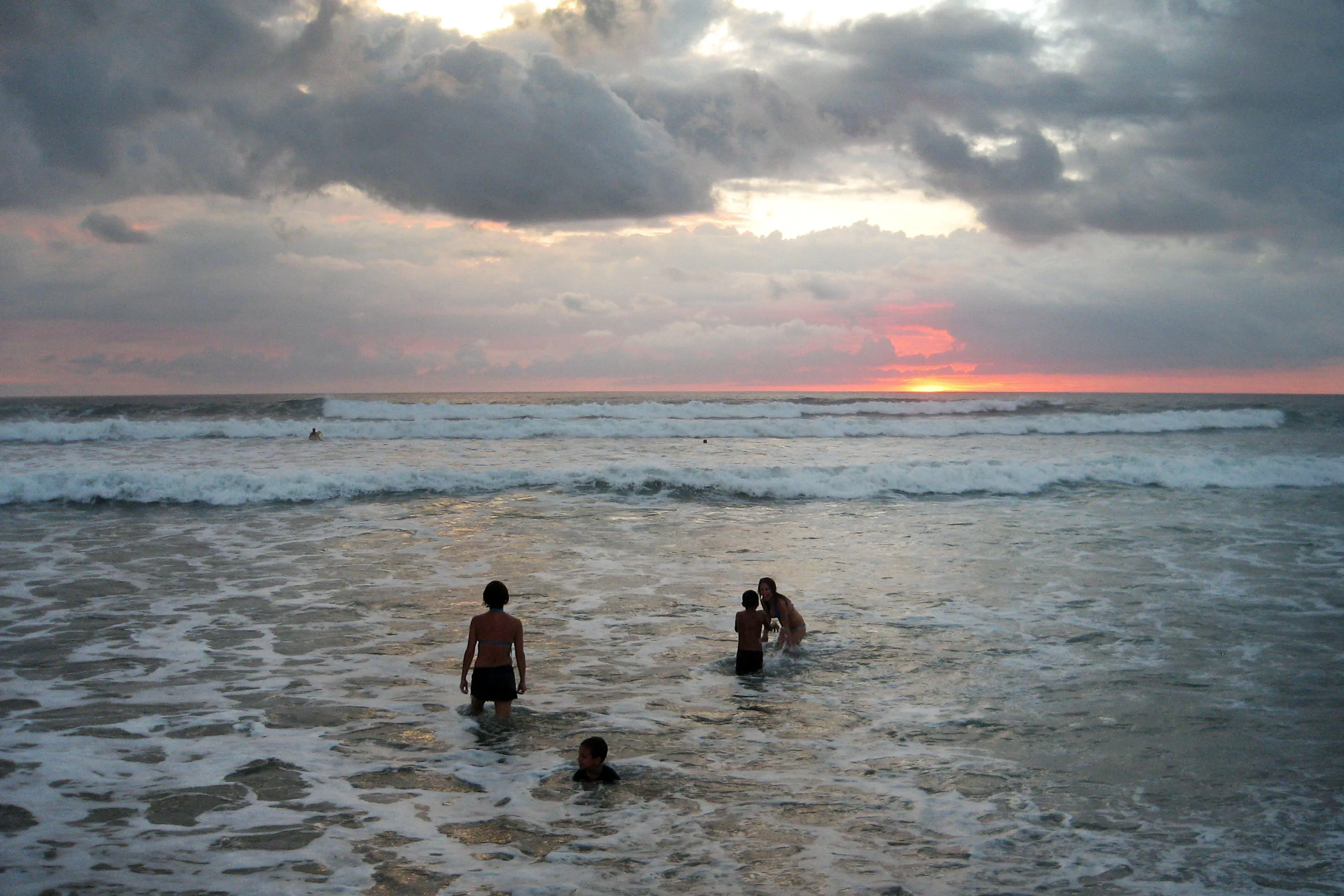 Beach-goers in Playa Guiones, Nosara, Costa Rica