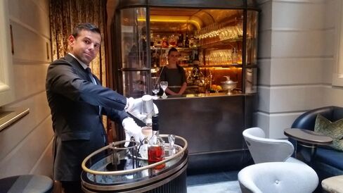 Agostino Perrone, director of mixology, makes a cocktail at the trolley in the Champagne Room.