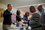 President Barack Obama and the first family serving Thanksgiving dinner at a church homeless center in Washington, D.C., in 2015.