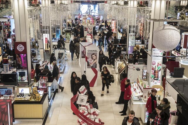 Shoppers walk through a Macy's Inc. department store in New York on Dec. 21 2016
