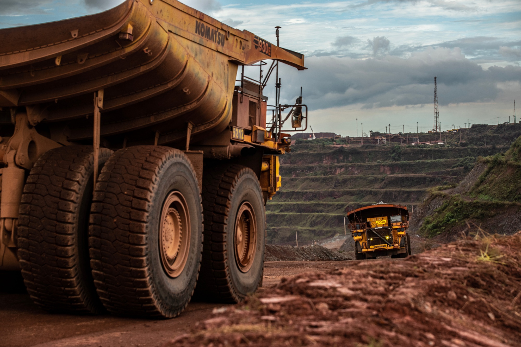 Haul trucks move iron ore at a&nbsp;Vale mine in&nbsp;Brazil.