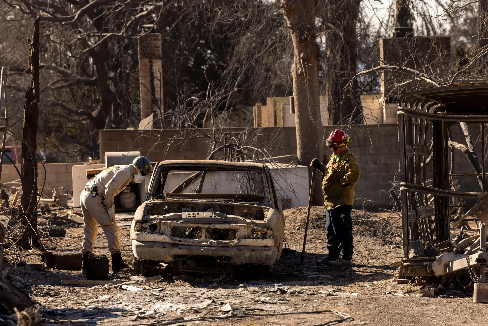 Search and rescue crews assist in the hunt for victims after the Eaton Fire in Altadena. 