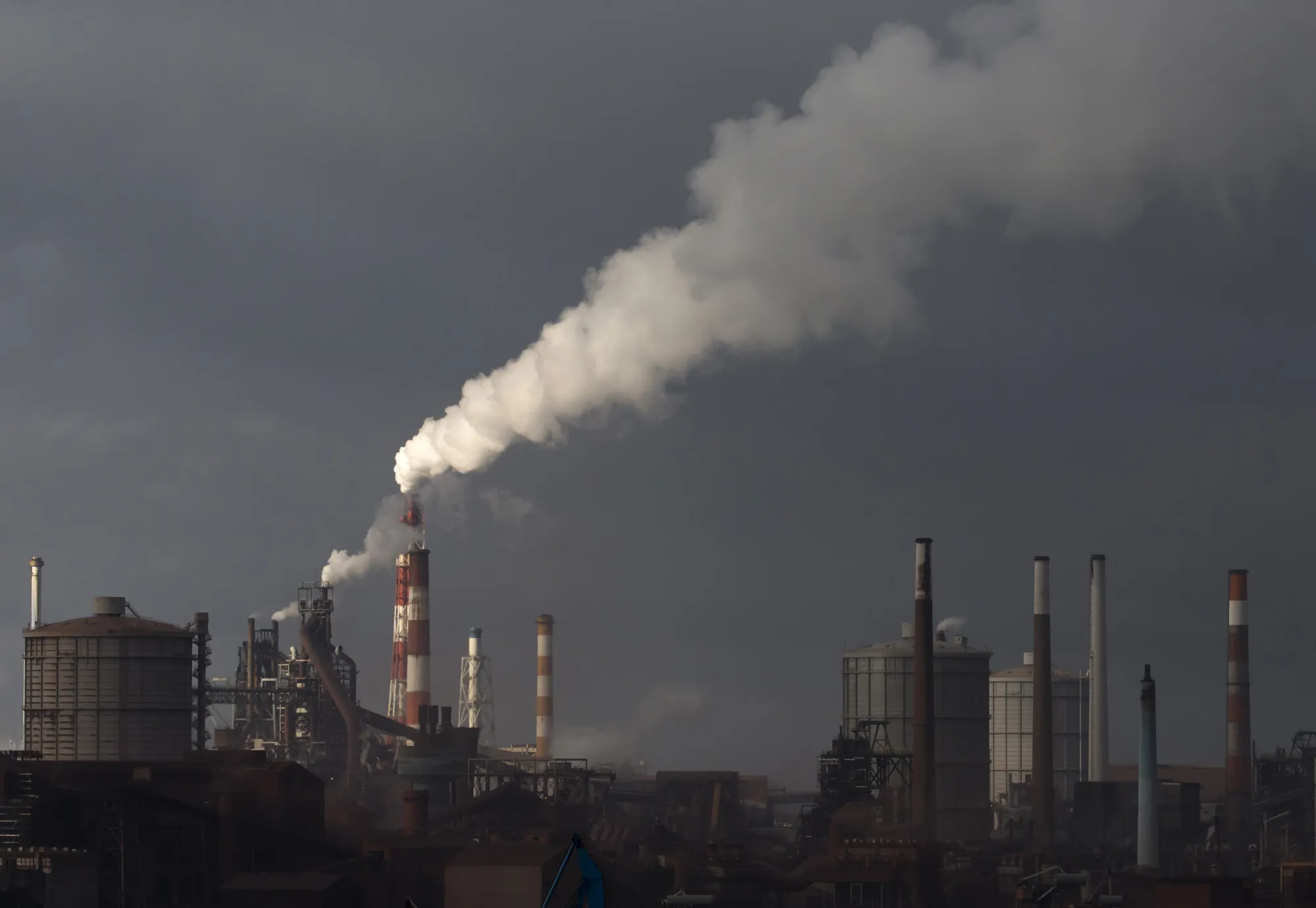 Emissions rise from chimneys at the Nippon Steel &amp; Sumitomo Metal Corp. plant&nbsp;in Kashima,&nbsp;Japan.
