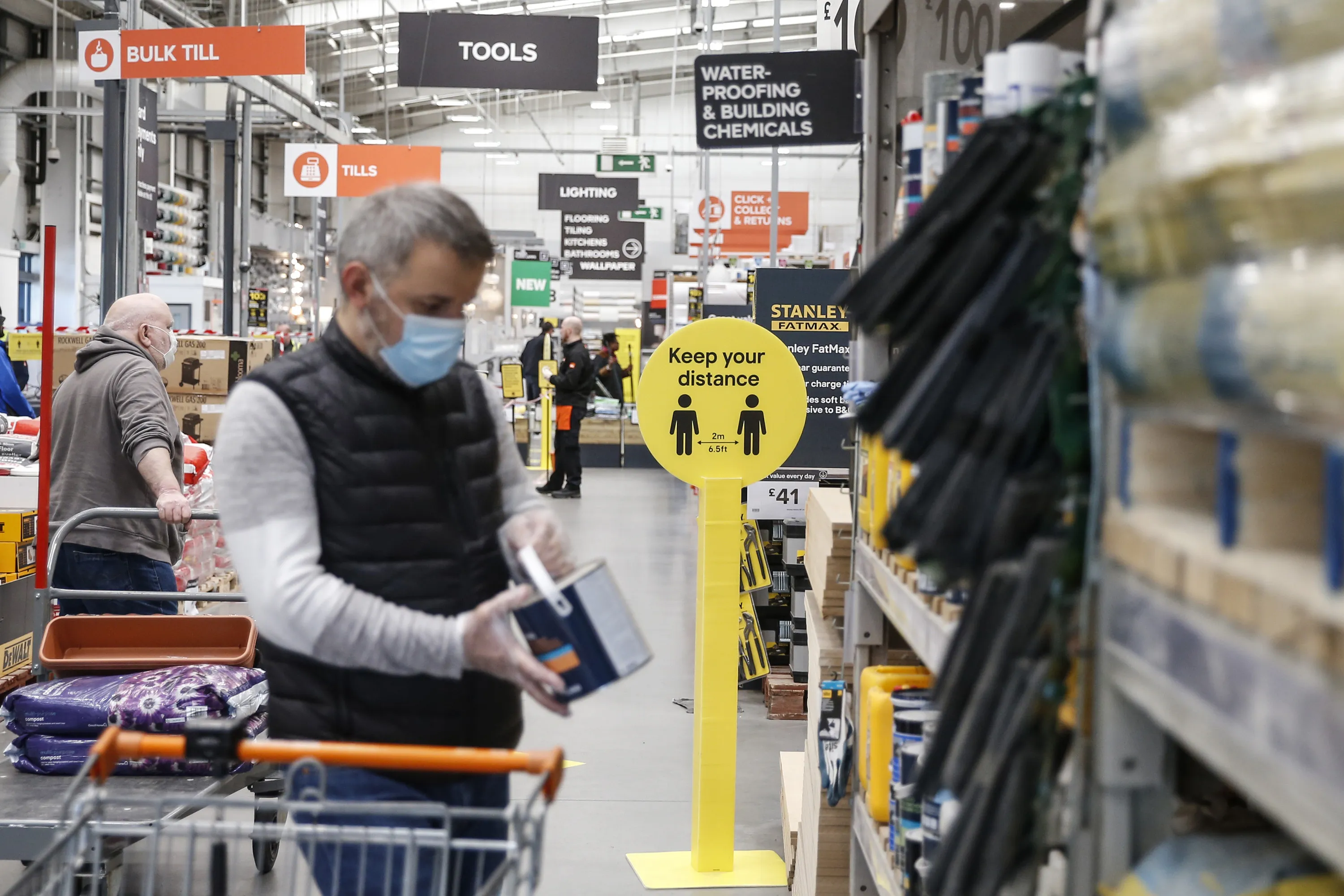 Customers maintain social distancing measures at a B&amp;Q store in London, on May 2.