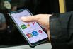 A user downloading the Kaspi app.