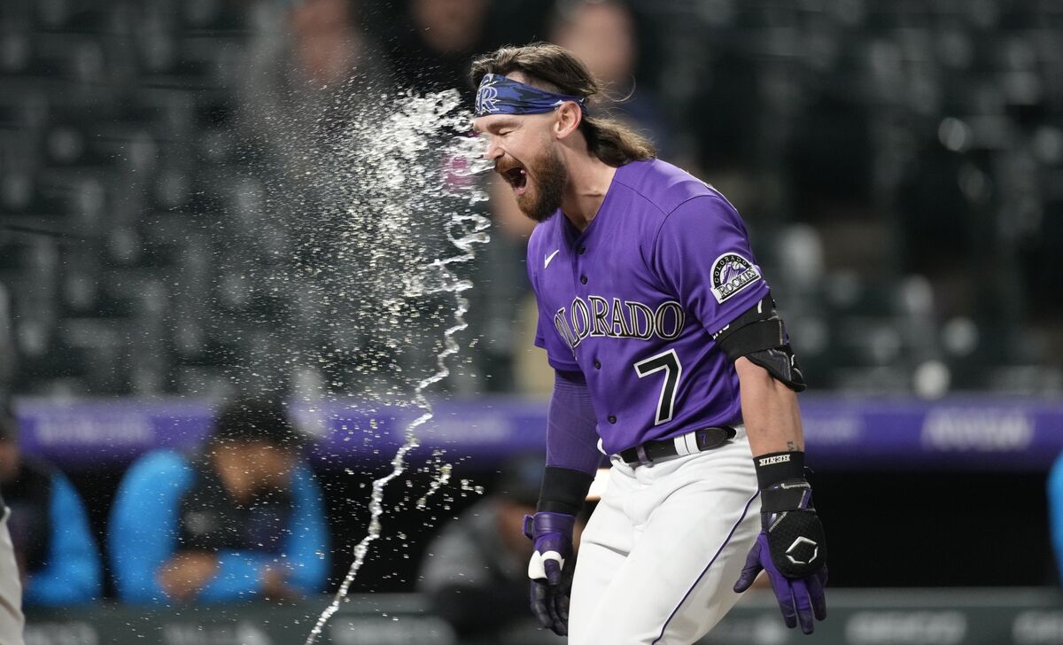 Colorado Rockies outfielder Randal Grichuk reacts after pitching during the  ninth inning of the first baseball game of the team's doubleheader against  the Miami Marlins on Wednesday, June 1, 2022, in Denver.