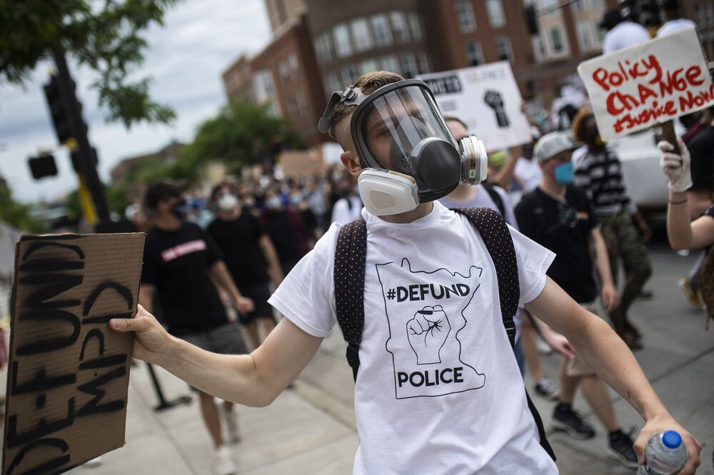 A demonstrator wears a defund police T shirt during a protest in Minneapolis on June 6.
