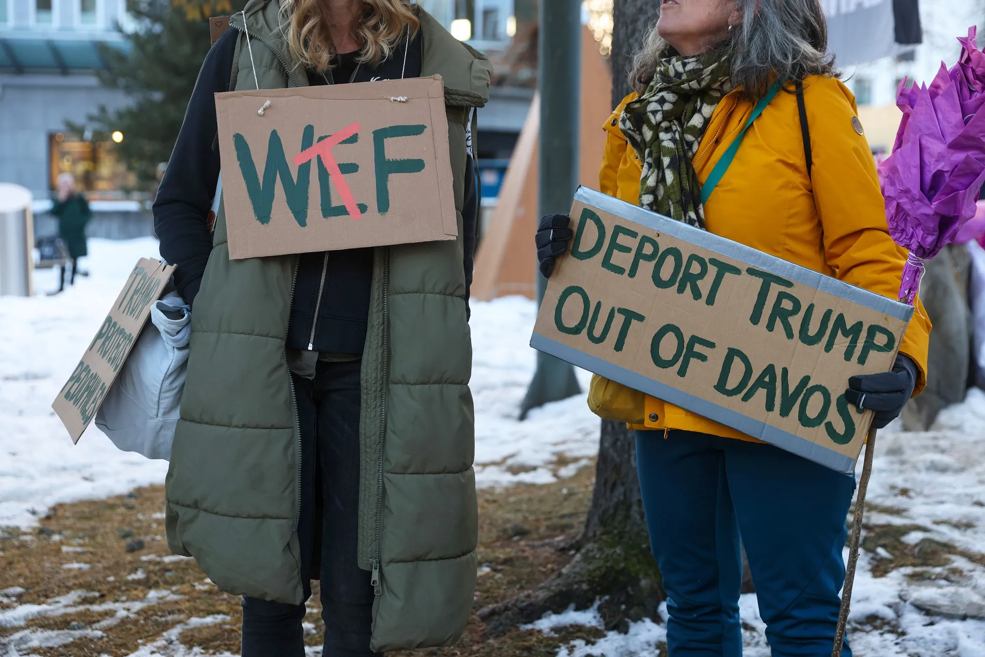 An-anti WEF protester holds a placard in Davos on Sunday.