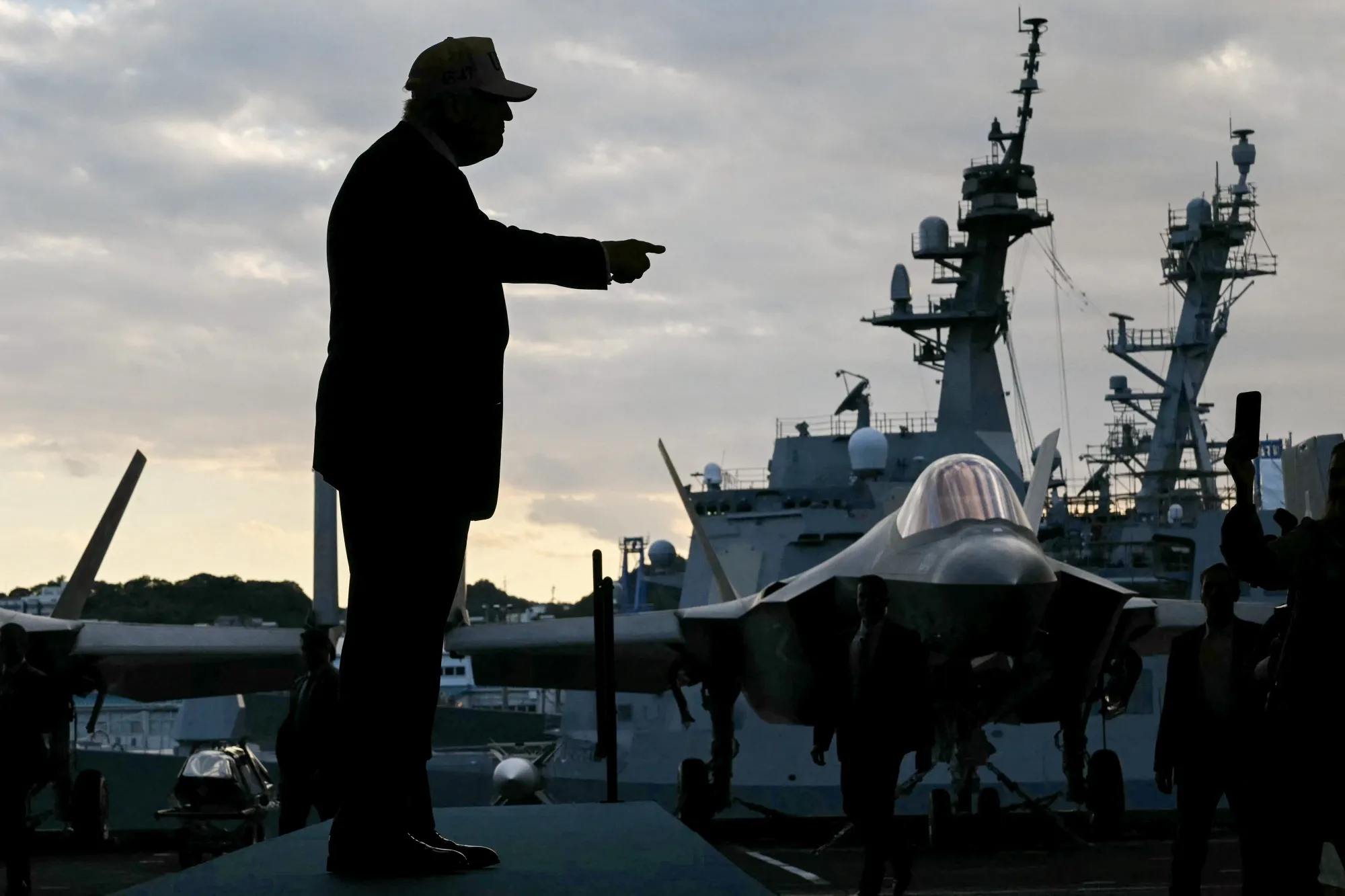 US President Donald Trump arrives to speak on the US Navy's USS George Washington aircraft carrier at the US naval base in Yokosuka on Oct. 28.