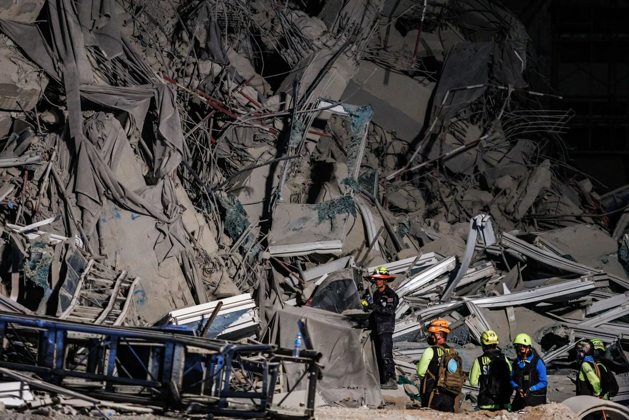 Emergency workers at the site of a collapsed building following an earthquake in Bangkok on March 28.
