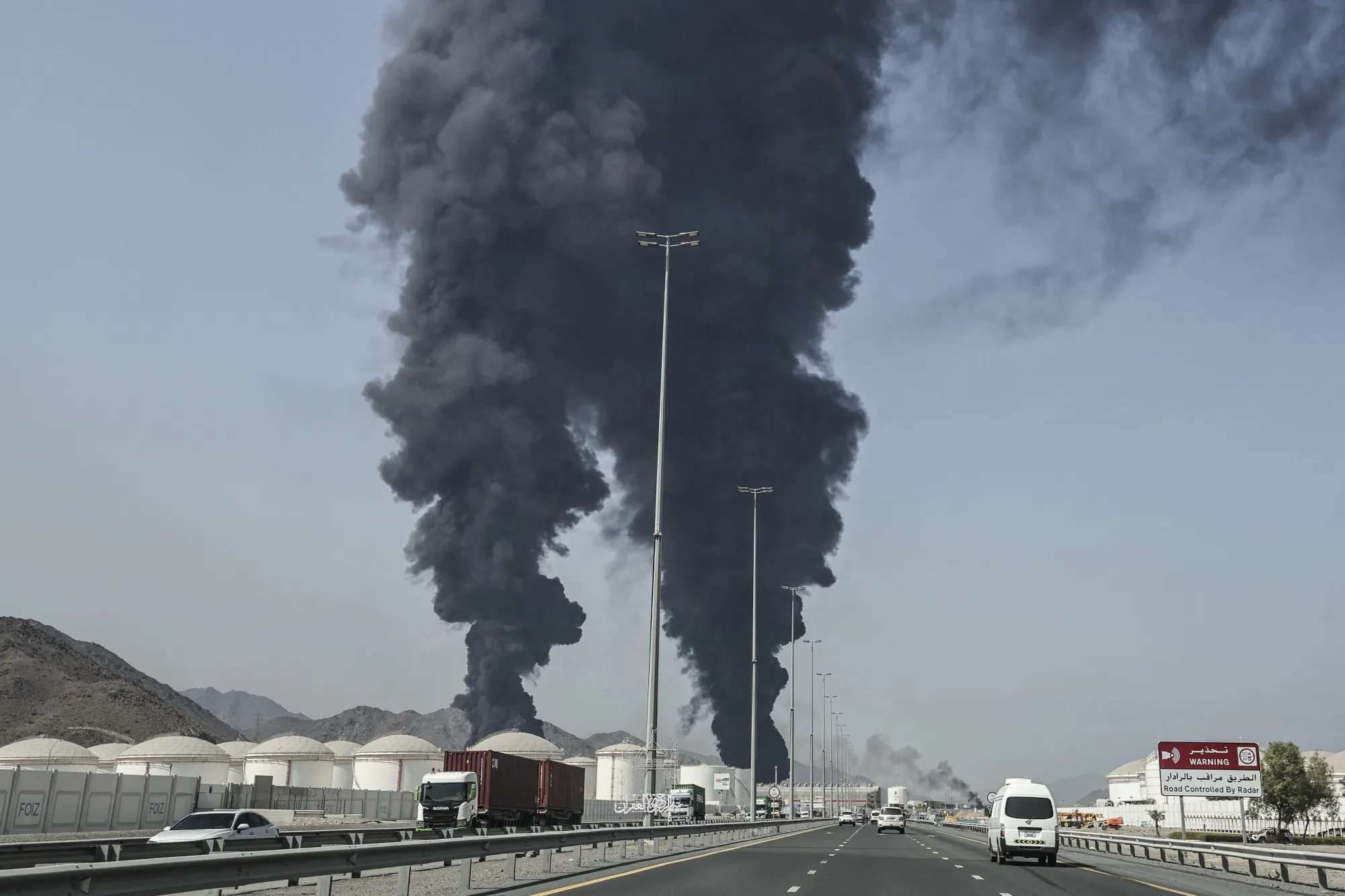 Smoke rises from the direction of an energy installation in the Gulf emirate of Fujairah on March 14.