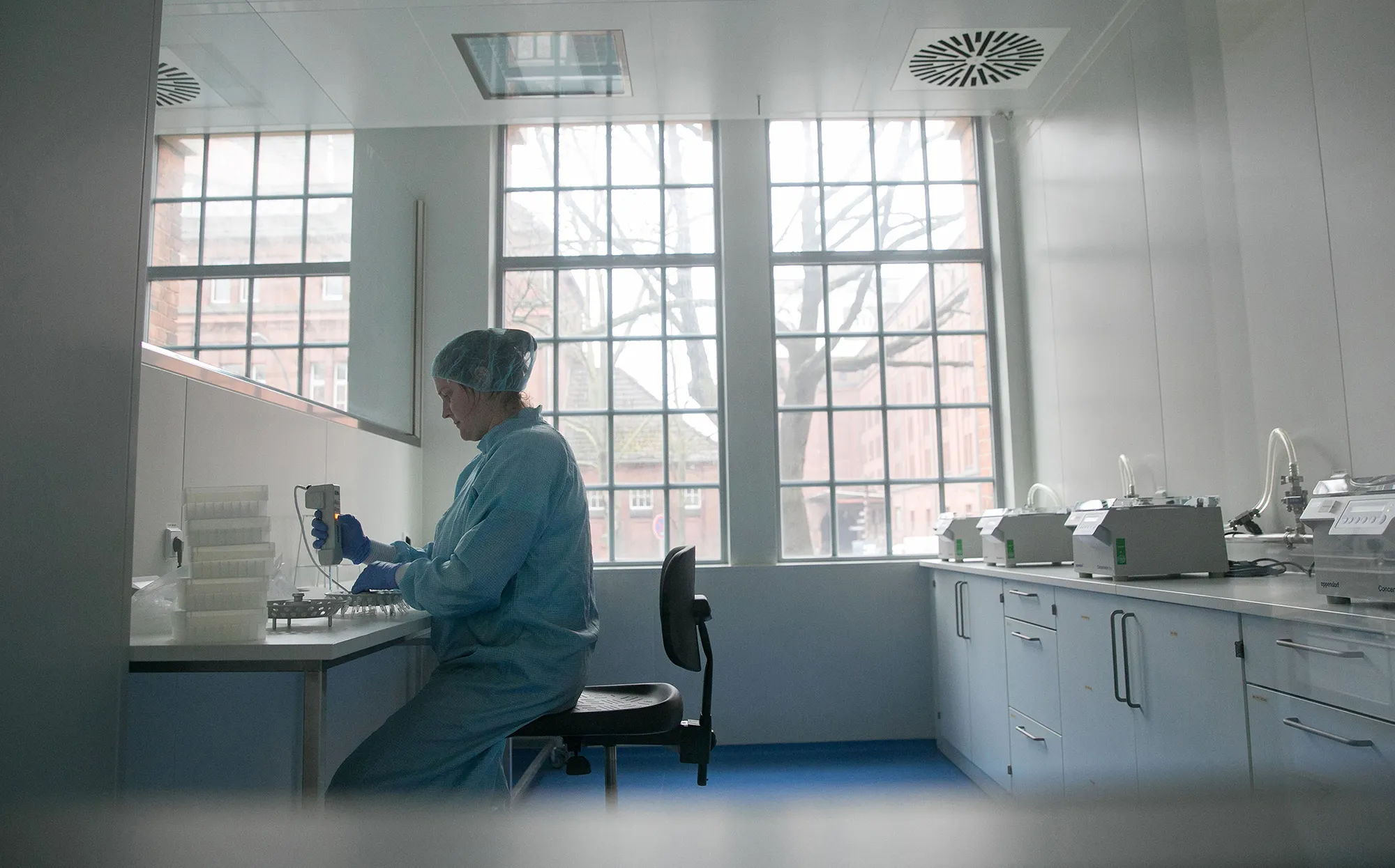 A lab technician prepares solutions for the manufacture of coronavirus diagnostic test kits in Berlin.
