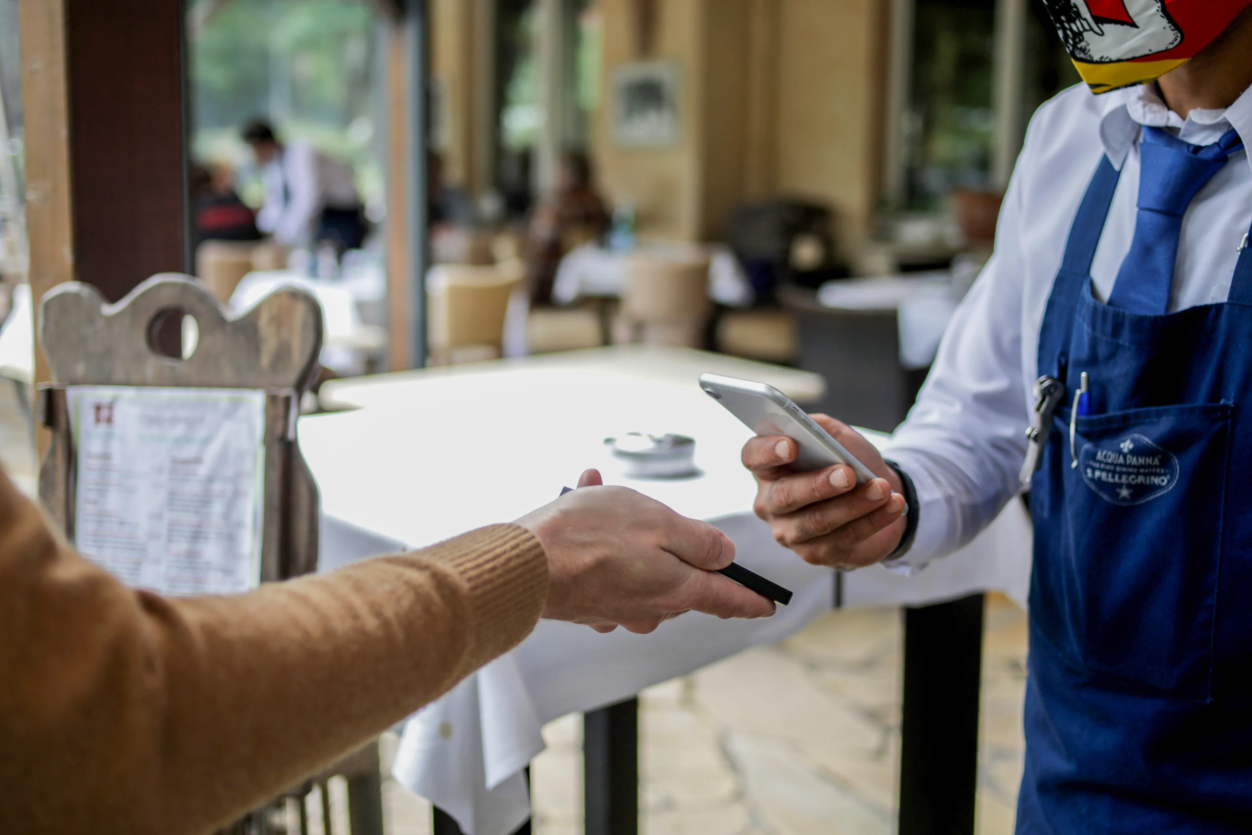 A Covid app check at a restaurant in Berlin, Germany.