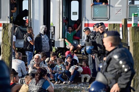 Migrants wait at Tovarnik railway station.