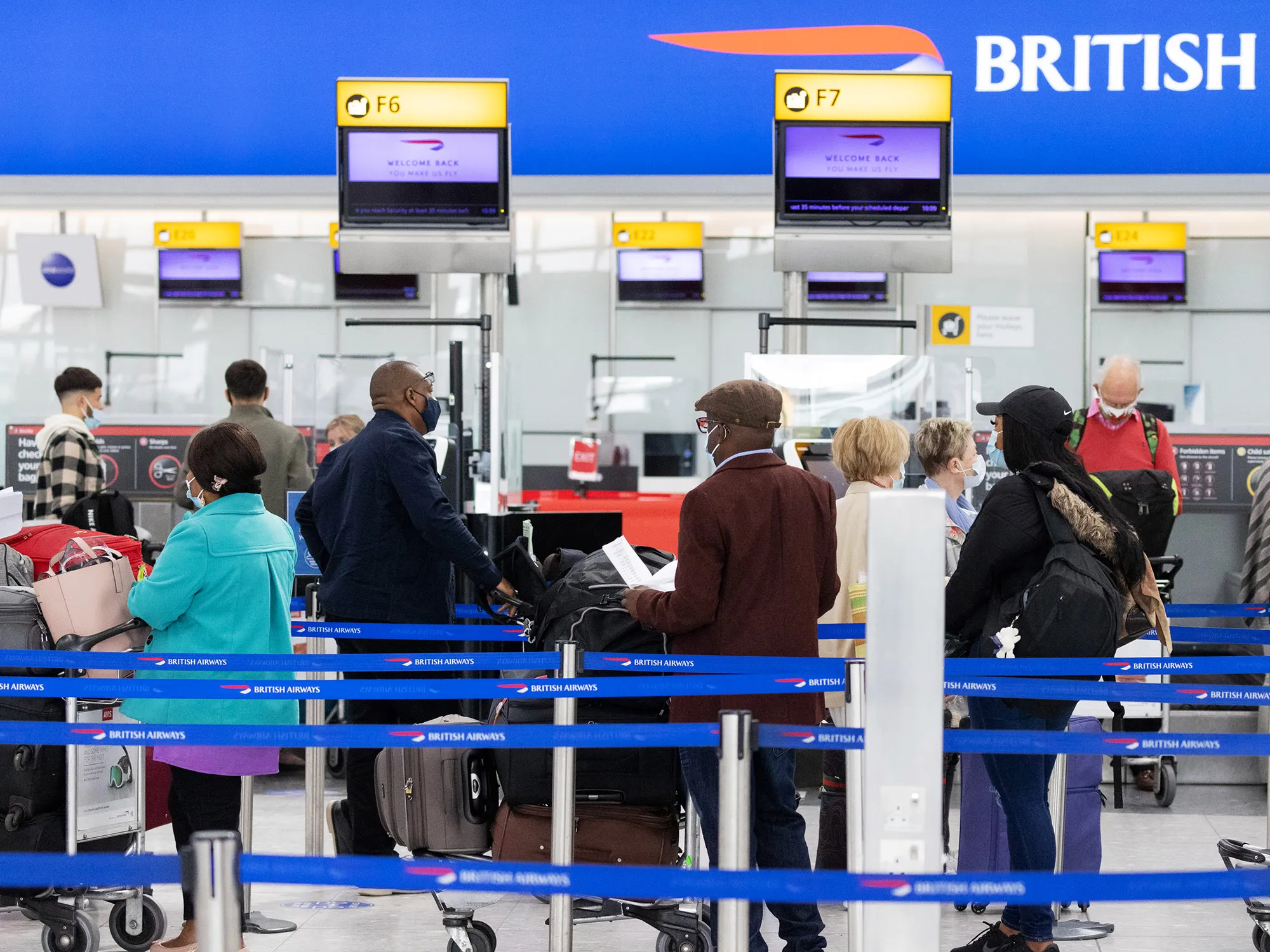 Passengers wait at check-in desks&nbsp;at London Heathrow Airport in London, U.K., on&nbsp;May 17.