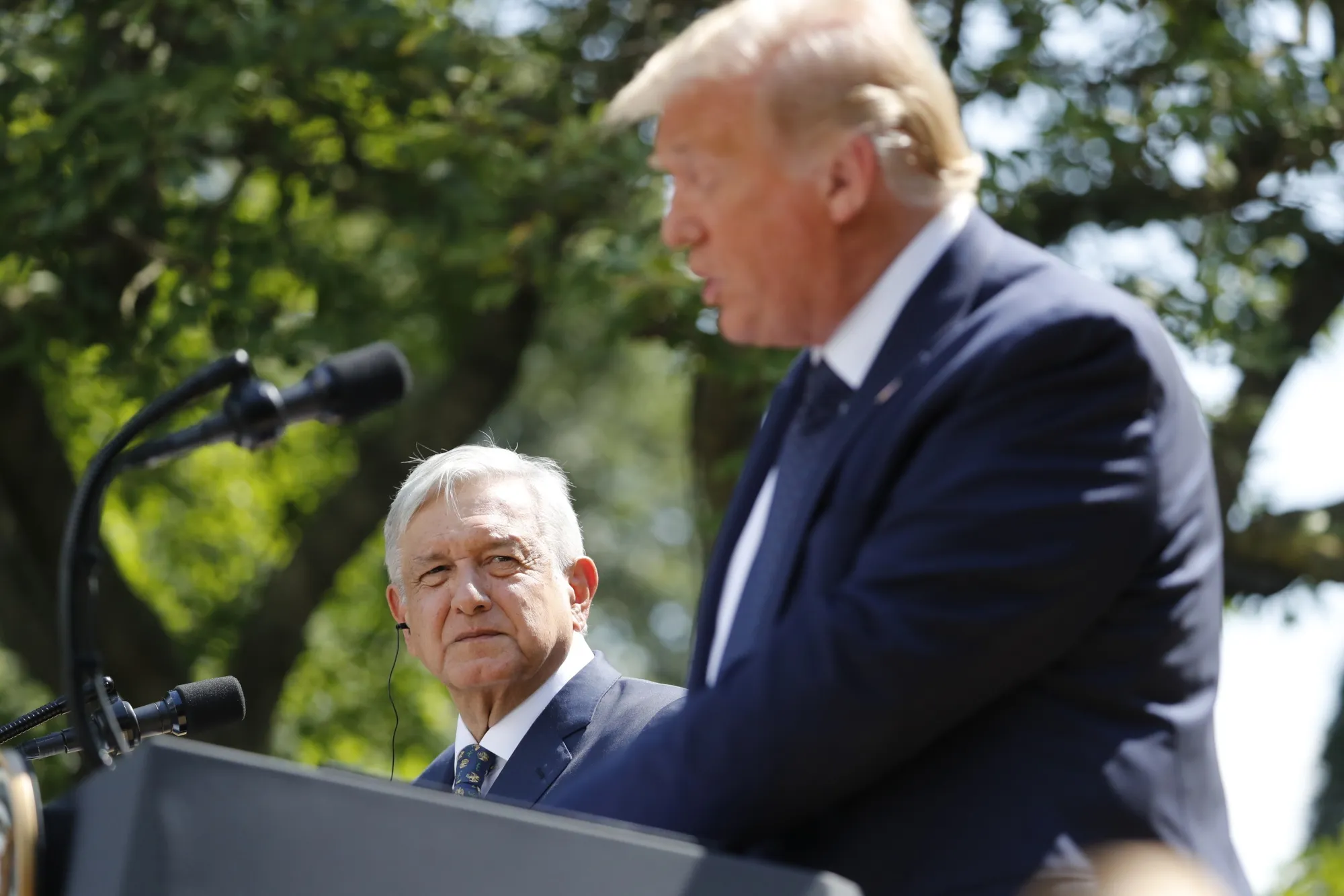 Andres Manuel Lopez Obrador listens as Donald Trump speaks outside the White House in Washington, D.C. on July 8.