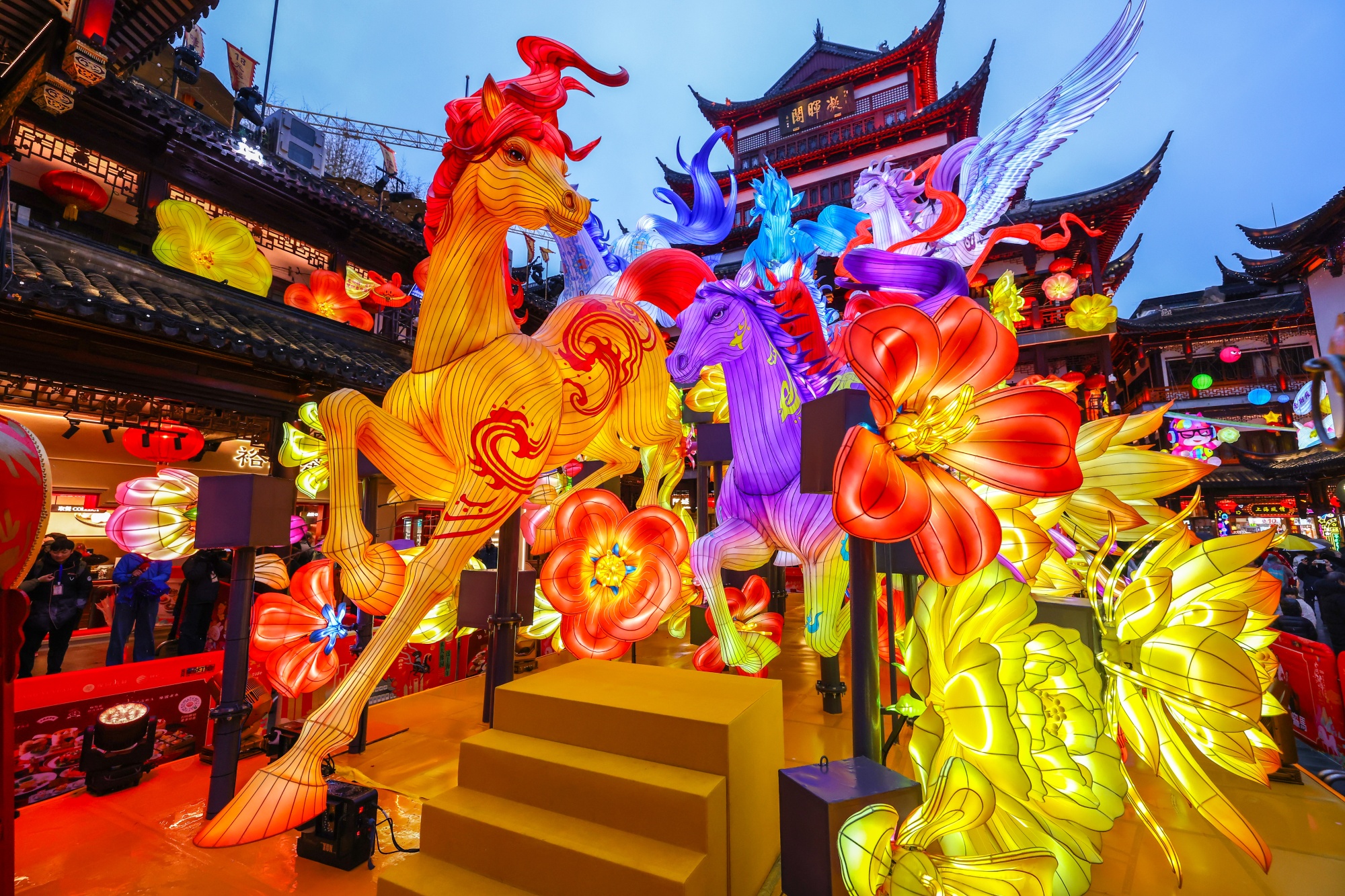 SHANGHAI, CHINA - JANUARY 26: Visitors view the illuminated lantern installations at the Yuyuan Garden Lantern Festival at Yuyuan Garden on January 26, 2026 in Shanghai, China. The Yuyuan Garden Lantern Festival, which opened here on January 26, is a key cultural highlight in Shanghai during the Spring Festival celebration. (Photo by VCG/VCG via Getty Images) Photographer: VCG/Visual China Group