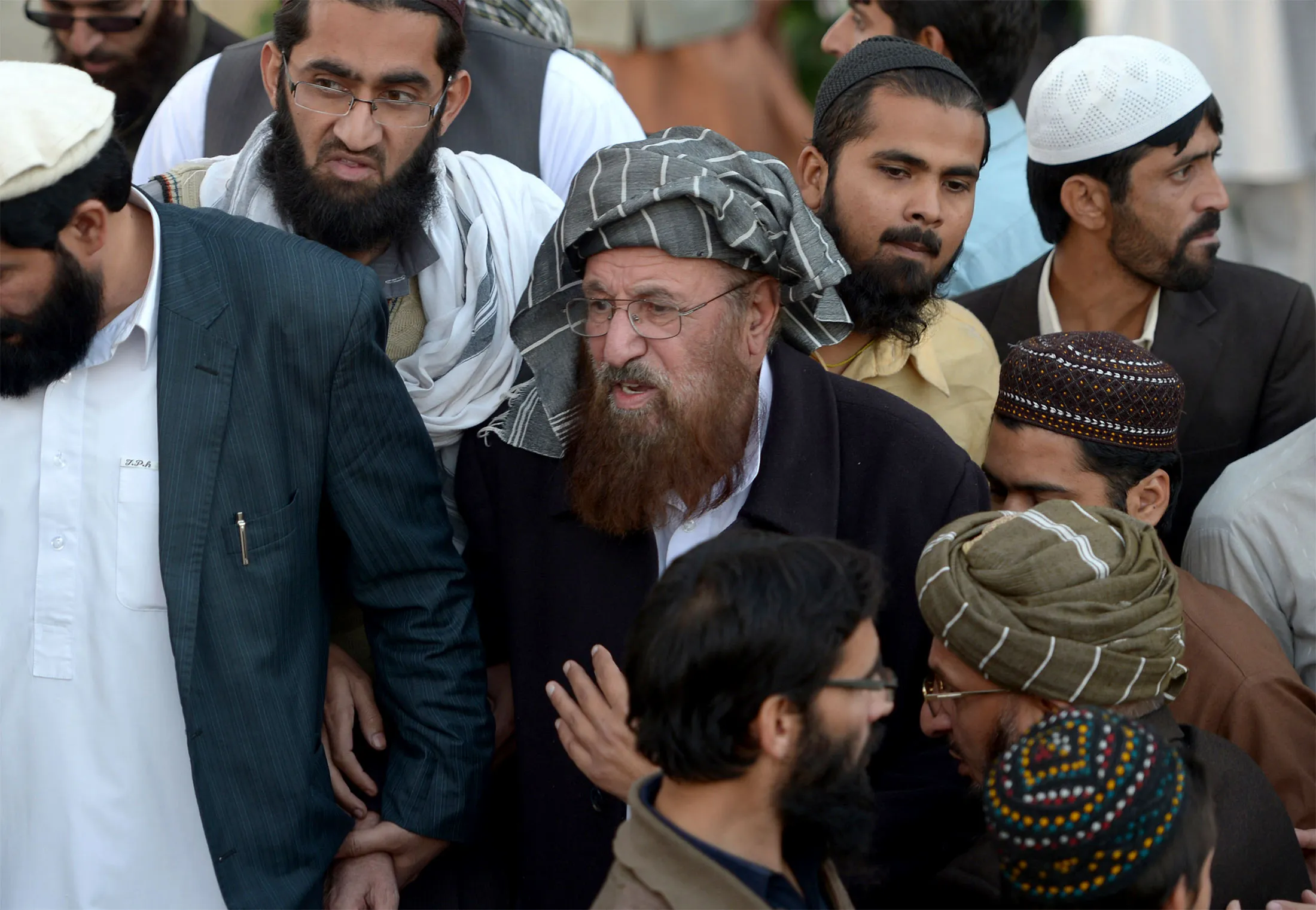 Maulana Samiul Haq, center, is seen in 2013.