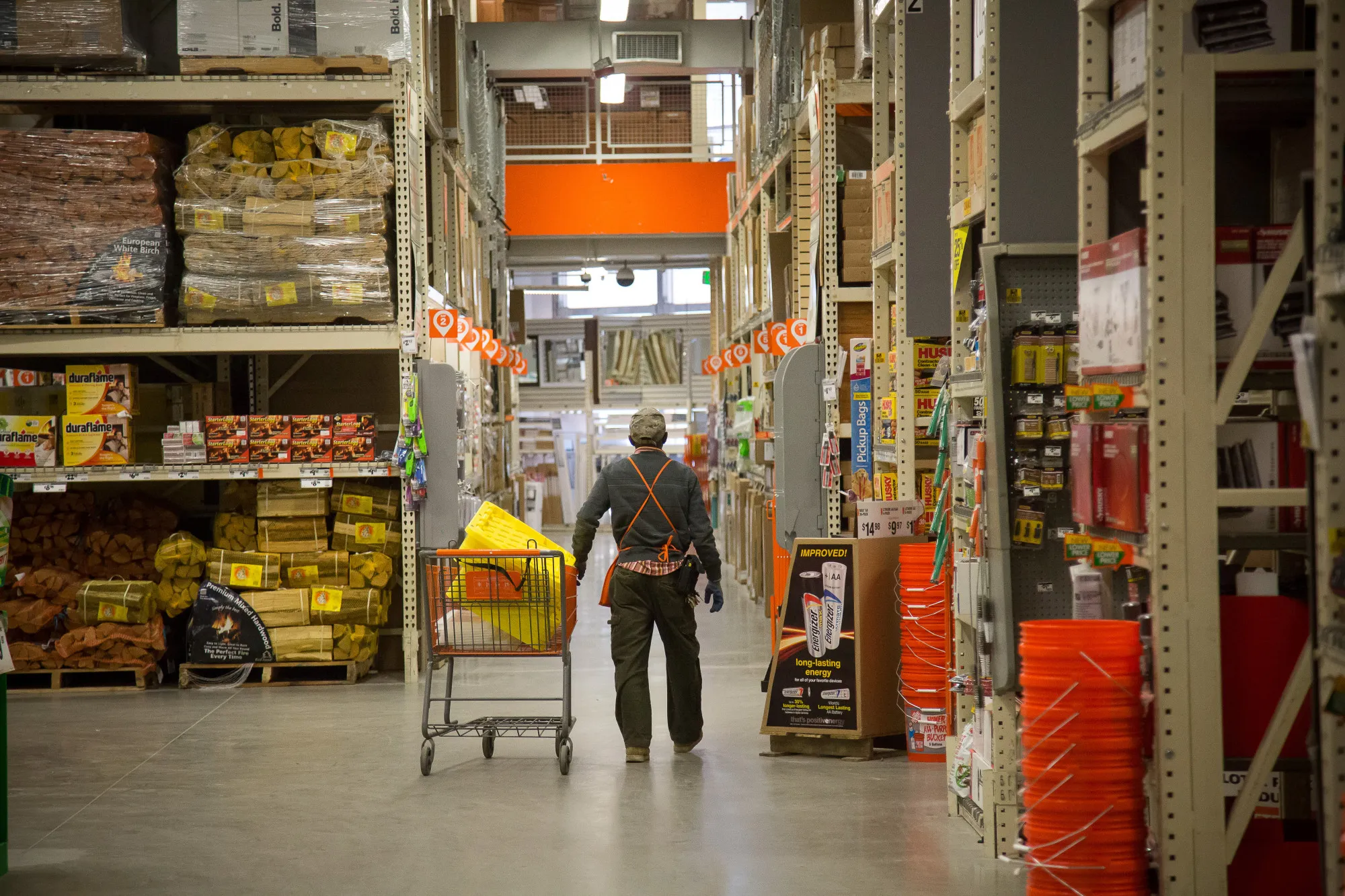An employee pushes a cart inside a Home Depot Inc. store in Jersey City, New Jersey.