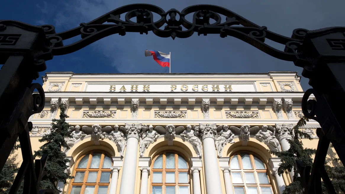 A Russian national flag flies from the roof of Russia's central bank.
