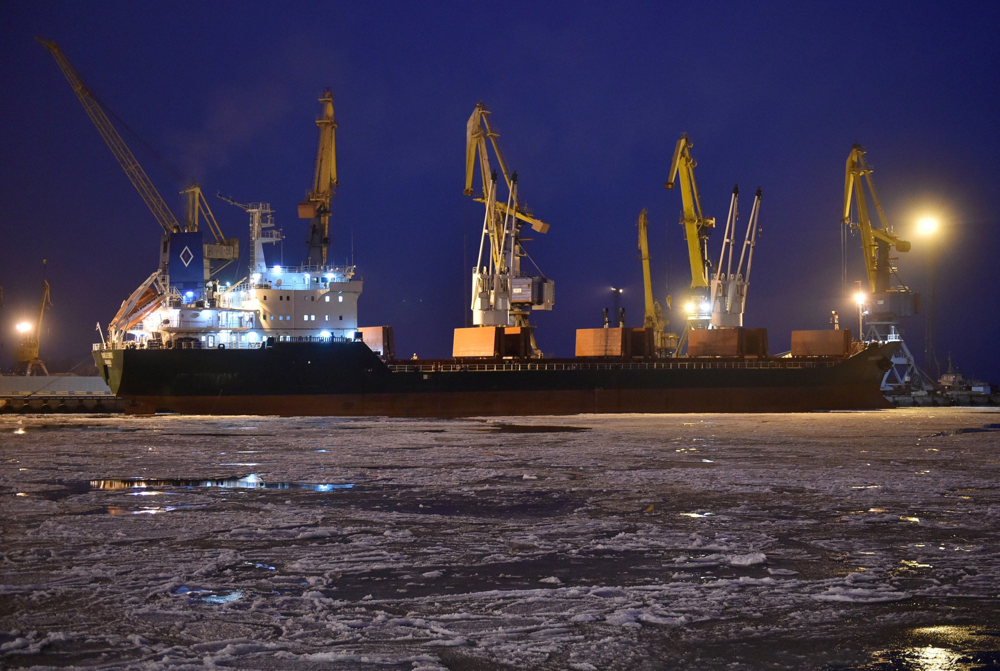 A cargo ship is moored by the Port of Mariupol on the Azov Sea.