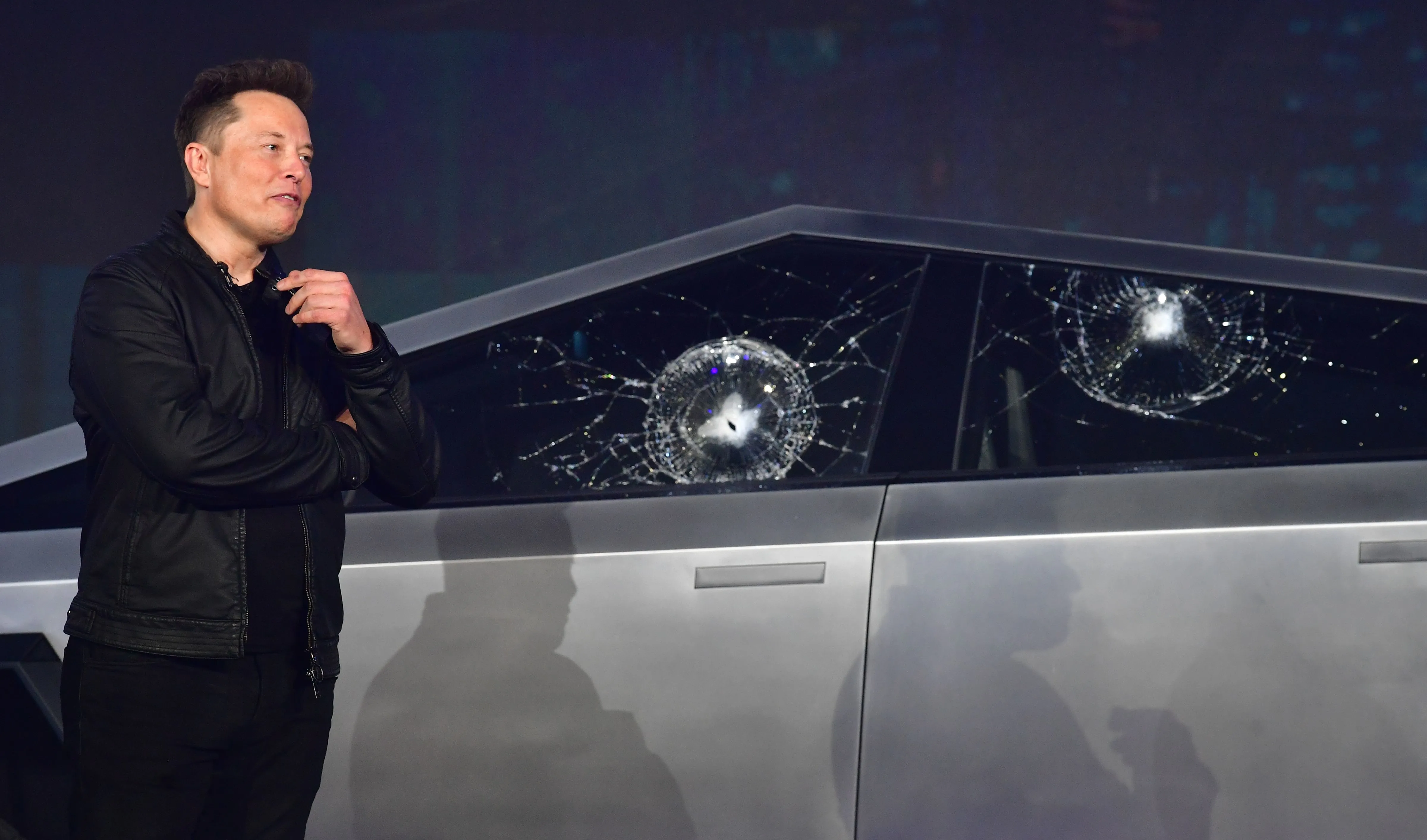 Tesla co-founder and CEO Elon Musk verbally reacts in front of the newly unveiled all-electric battery-powered Tesla Cybertruck with broken glass on windows following a demonstation that did not go as planned on November 21, 2019 at Tesla Design Center in Hawthorne, California. (Photo by Frederic J. BROWN / AFP) (Photo by FREDERIC J. BROWN/AFP via Getty Images)