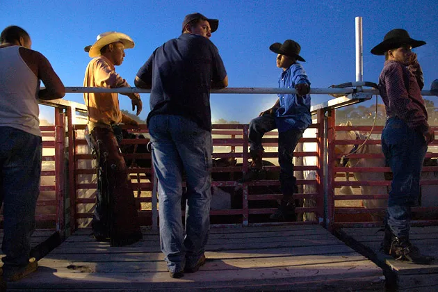 Native American riders at the rodeo chutes in Pine Ridge, S.D.

