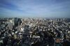 The Tokyo Tower, center, stands in the distance in Tokyo, Japan, on Monday, March 18, 2019. Amid intense debate on Japan’s inflation target, some officials at the central bank think the 2 percent goal will probably remain out of reach for the next three years, according to people familiar with the matter.
