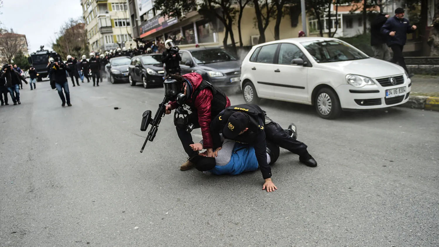 Police officers detain a Kurdish man in Istanbul on March 20, 2016.
