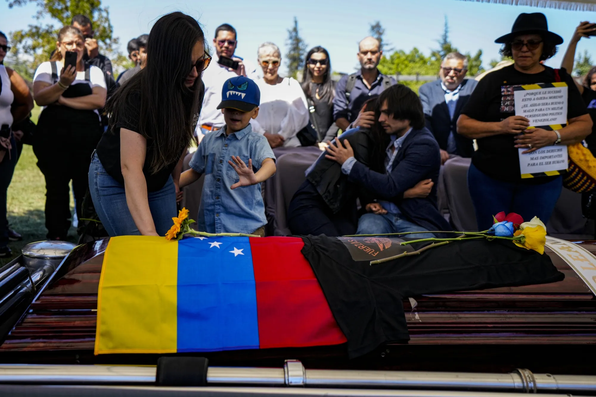 The widow, son, and sister of former Venezuelan military officer Ronald Ojeda bury him&nbsp;in Santiago, Chile.