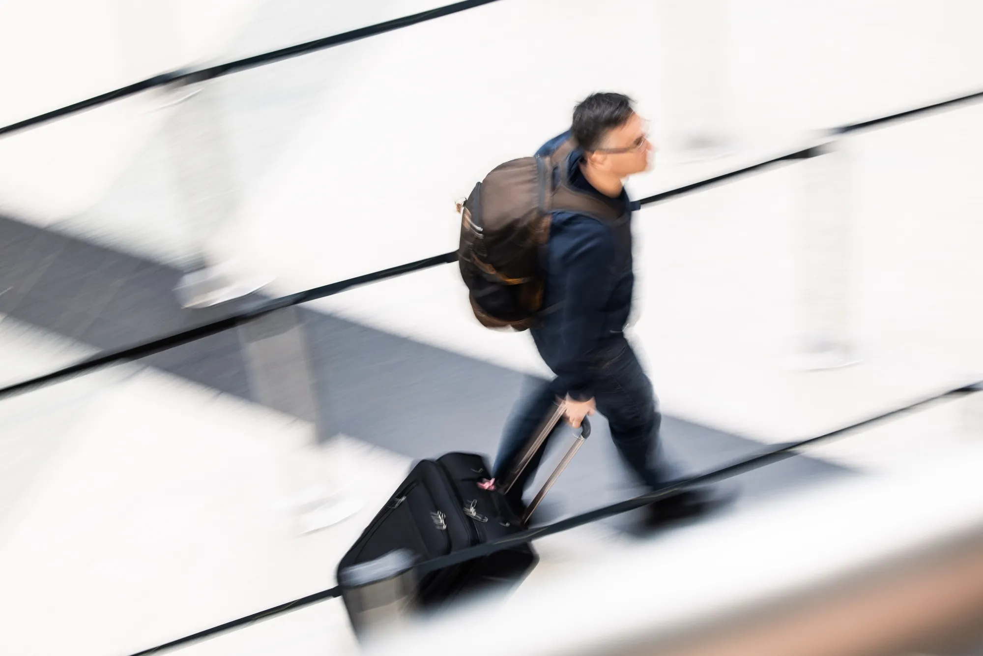 A passenger wheels luggage through the departures terminal at Budapest Ferenc Liszt International Airport in Budapest, Hungary, on Monday, Jan. 8, 2024.
