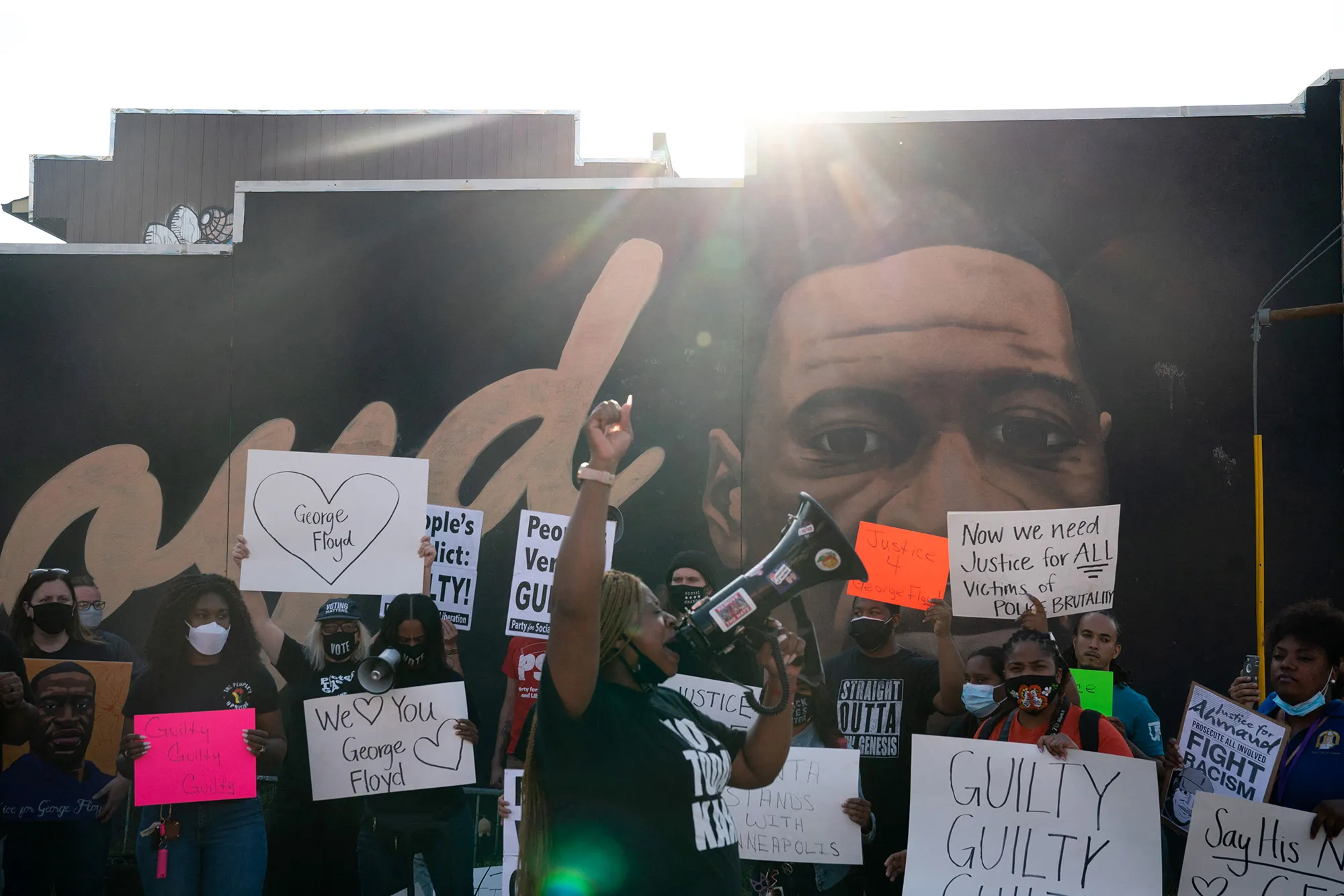 People demonstrate near&nbsp;a&nbsp;George Floyd mural following the guilty verdict in the trial of Derek Chauvin, in Atlanta on April 20.