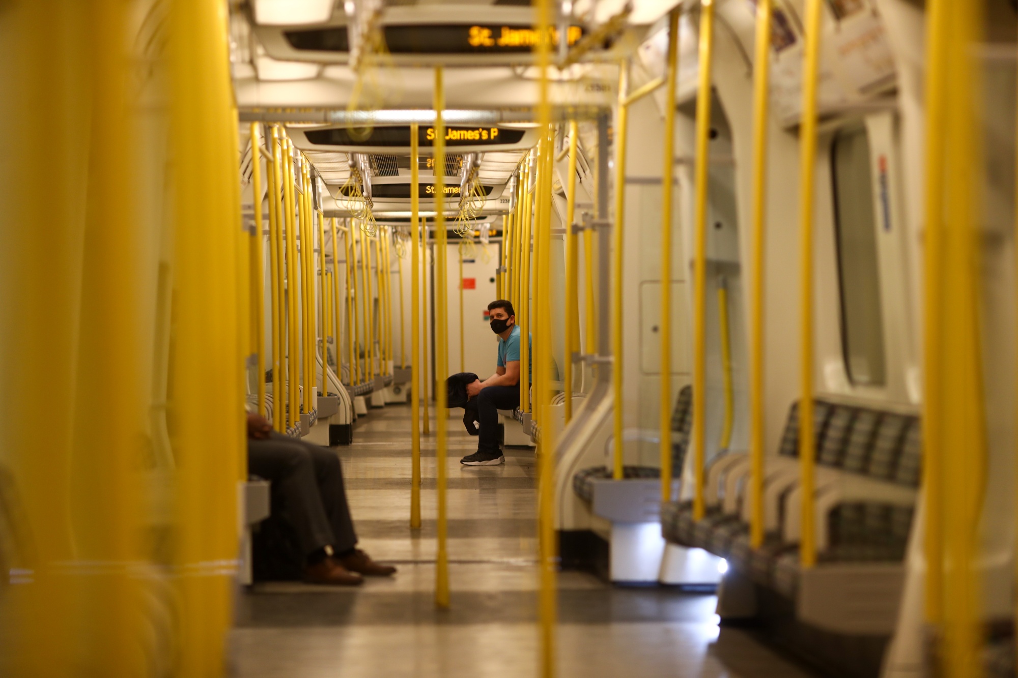 Passengers sit at safe social distances on a London Underground train in London on May 21.