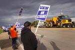 Workers picketing outside of the John Deere Davenport Works facility on Oct. 15 in Davenport, Iowa. More than 10,000 John Deere employees, represented by the United Auto Workers, walked of the job&nbsp;after contract talks&nbsp;failed.