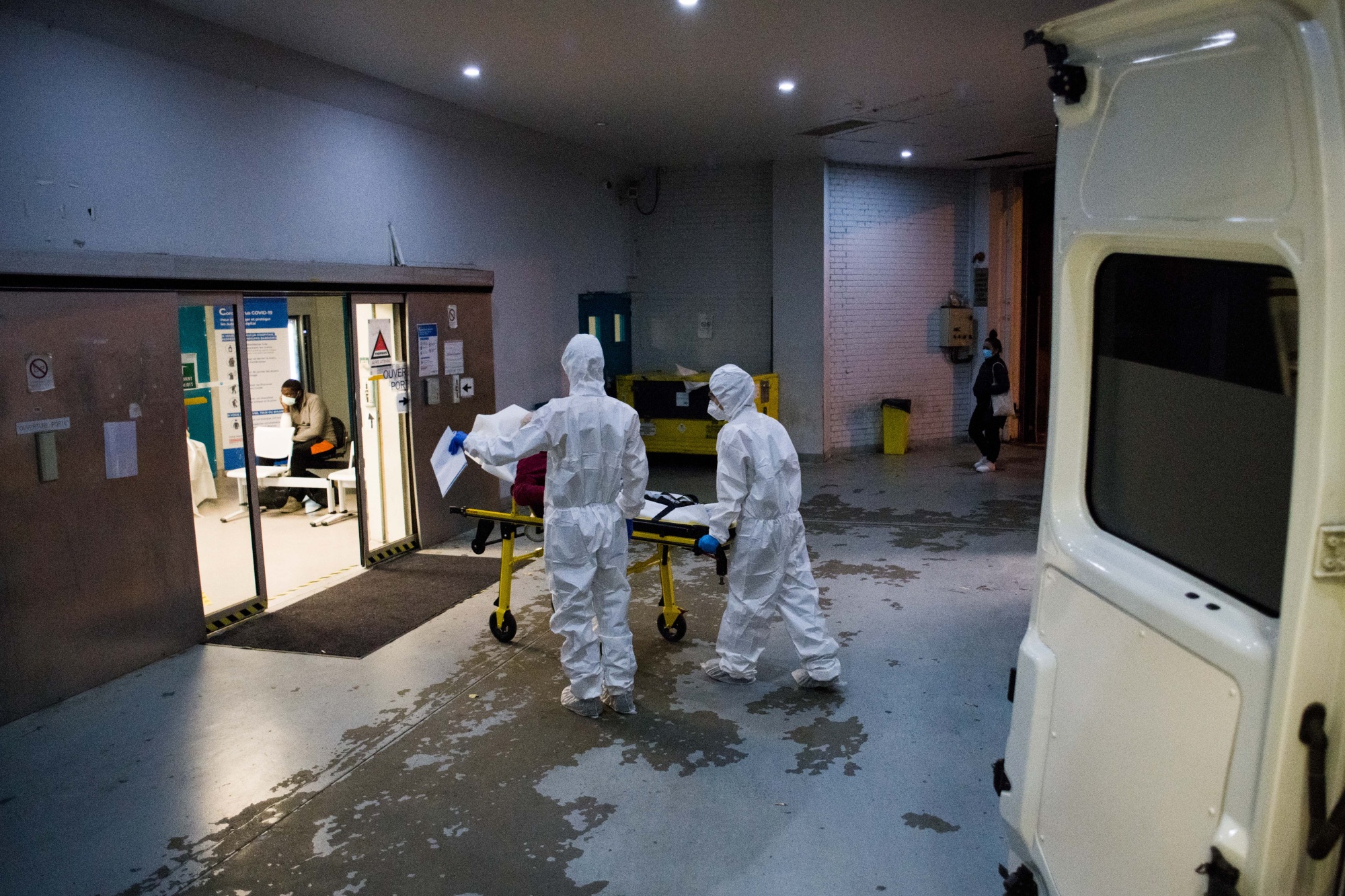 An ambulance crew transports a patient to a hospital in Paris, on Oct. 24.&nbsp;France reported 523 deaths from the disease on Tuesday, the most since April 22.&nbsp;