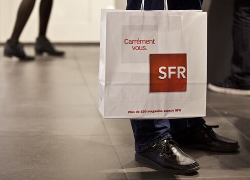 A Customer Carries a Shopping Bag inside an SFR Store