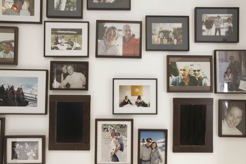 Framed photographs, many of which feature her late husband, interior decorator Eric Zeller, with whom she designed the apartment.